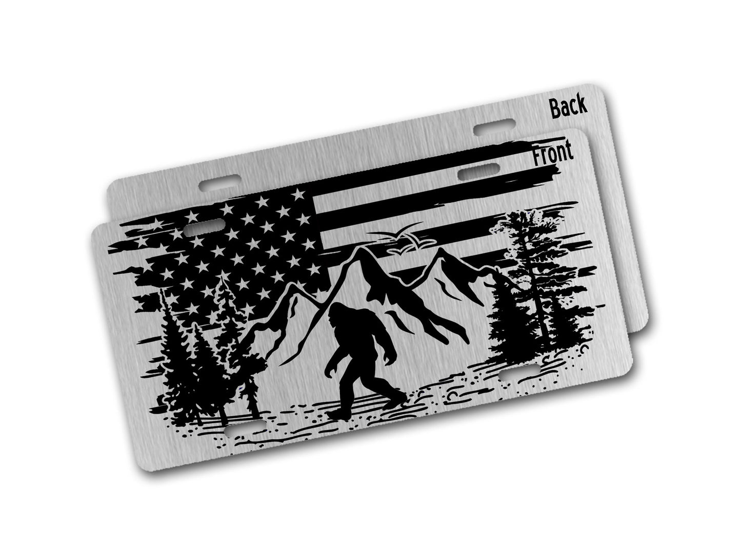 Aluminum license plate with American flag, mountains, and a bigfoot design on a white background