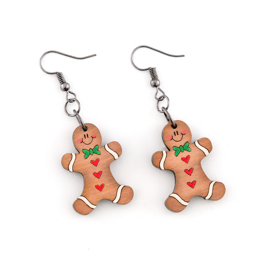 Gingerbread man earrings on a white background