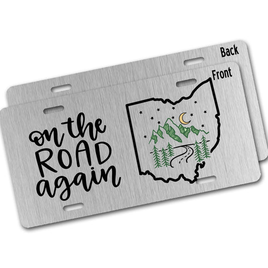 Metal license plate with 'on the road again' text and a map of Ohio on silver