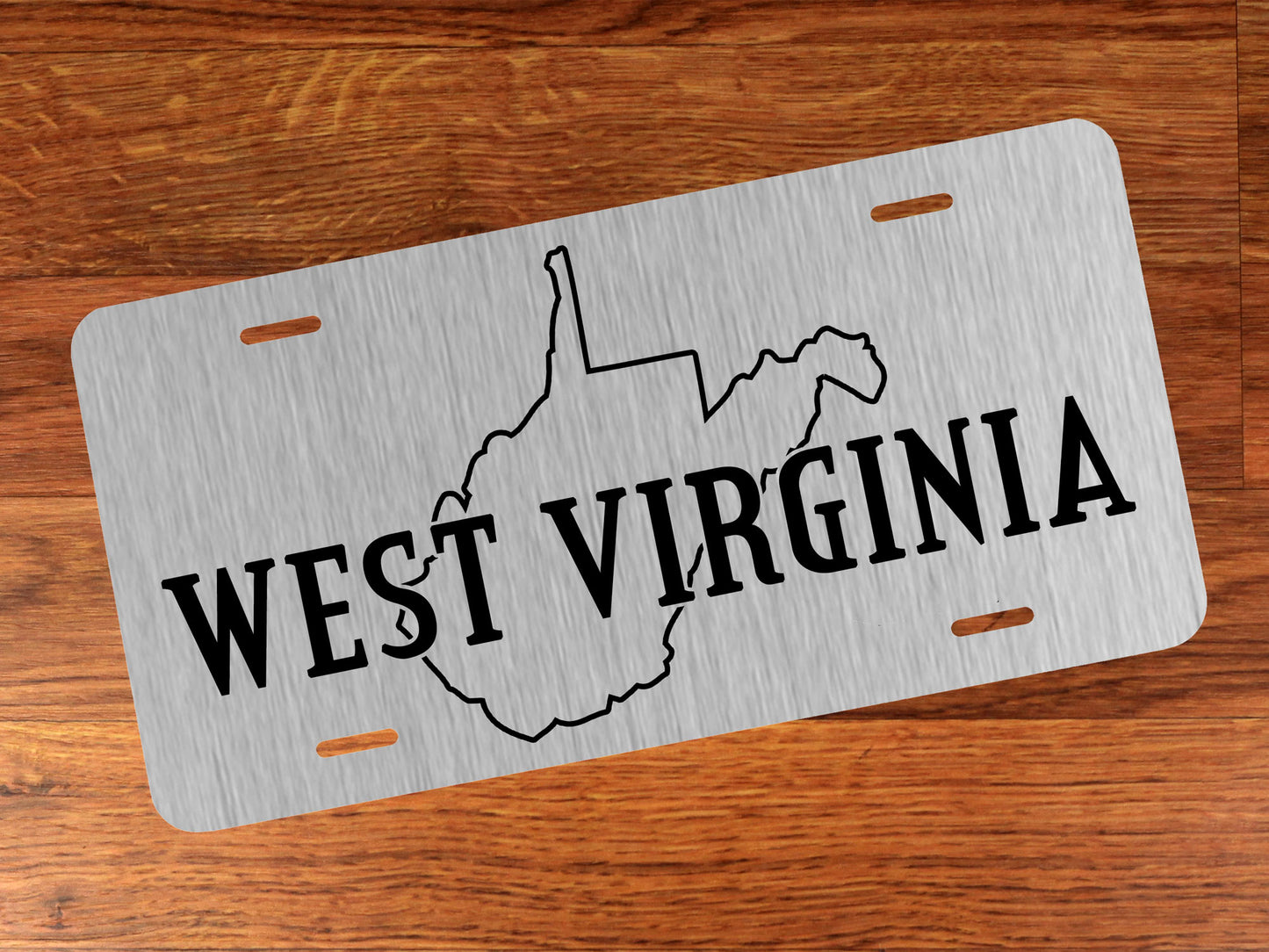 Aluminum license plate with West Virginia outline on silver